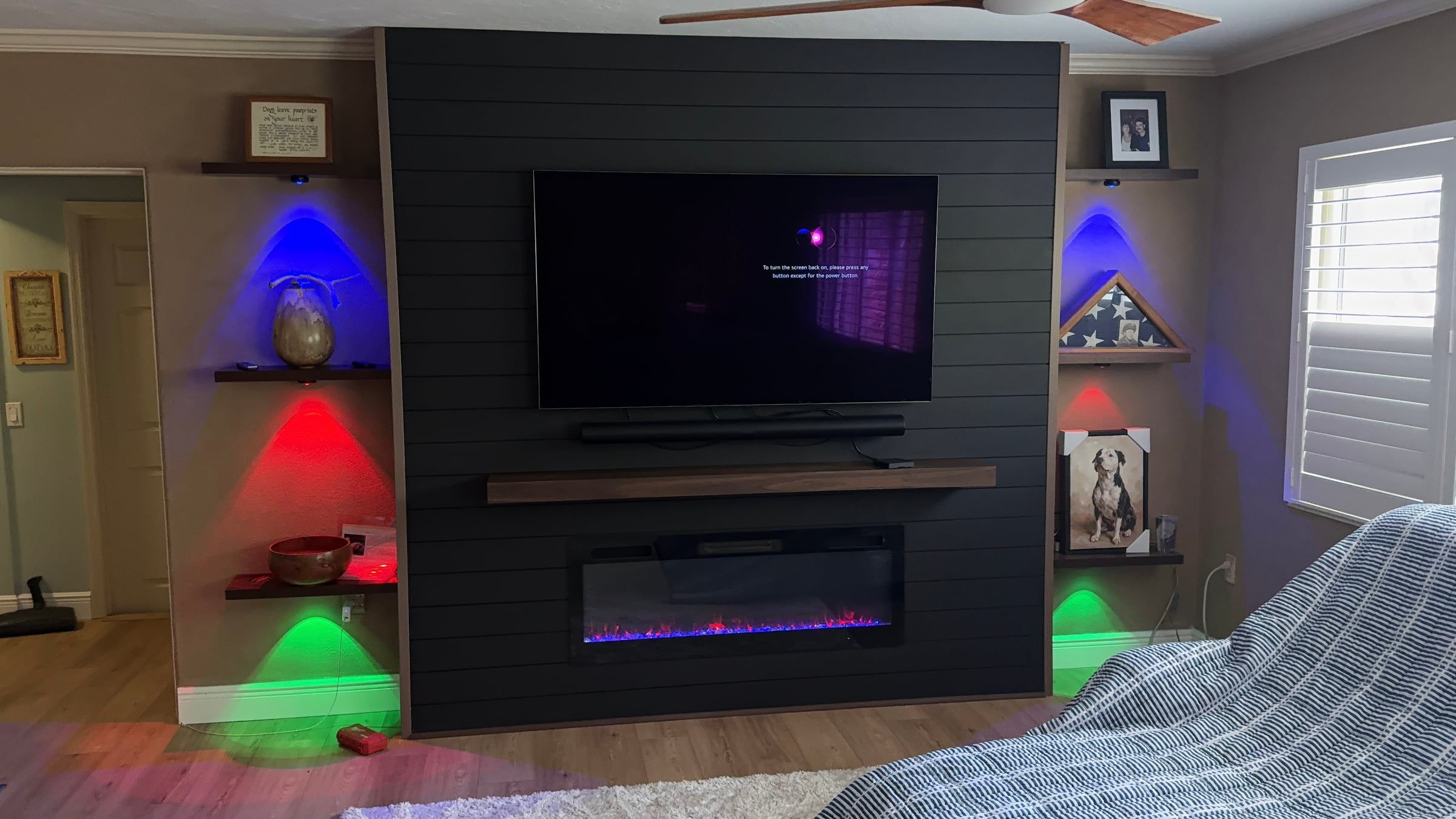 Black Media Wall with Electric Fireplace and Lit Floating Shelves in Sarasota, FL