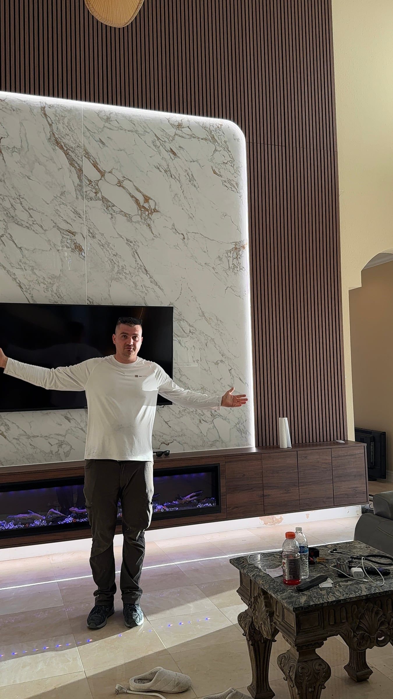 Double-Height Porcelain Slab Media Wall in Sarasota, FL — photo 15 of 17