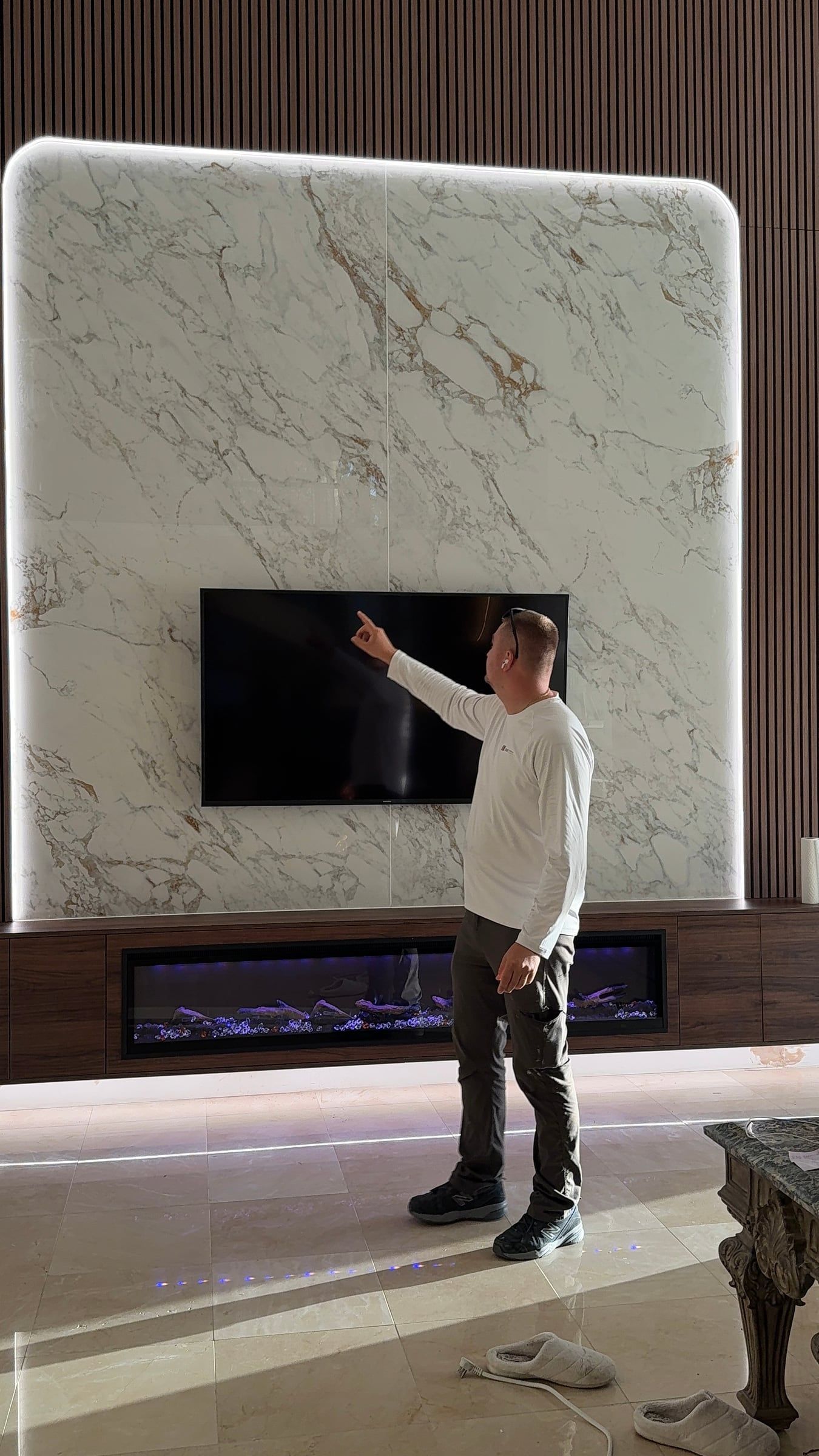 Double-Height Porcelain Slab Media Wall in Sarasota, FL — photo 16 of 17