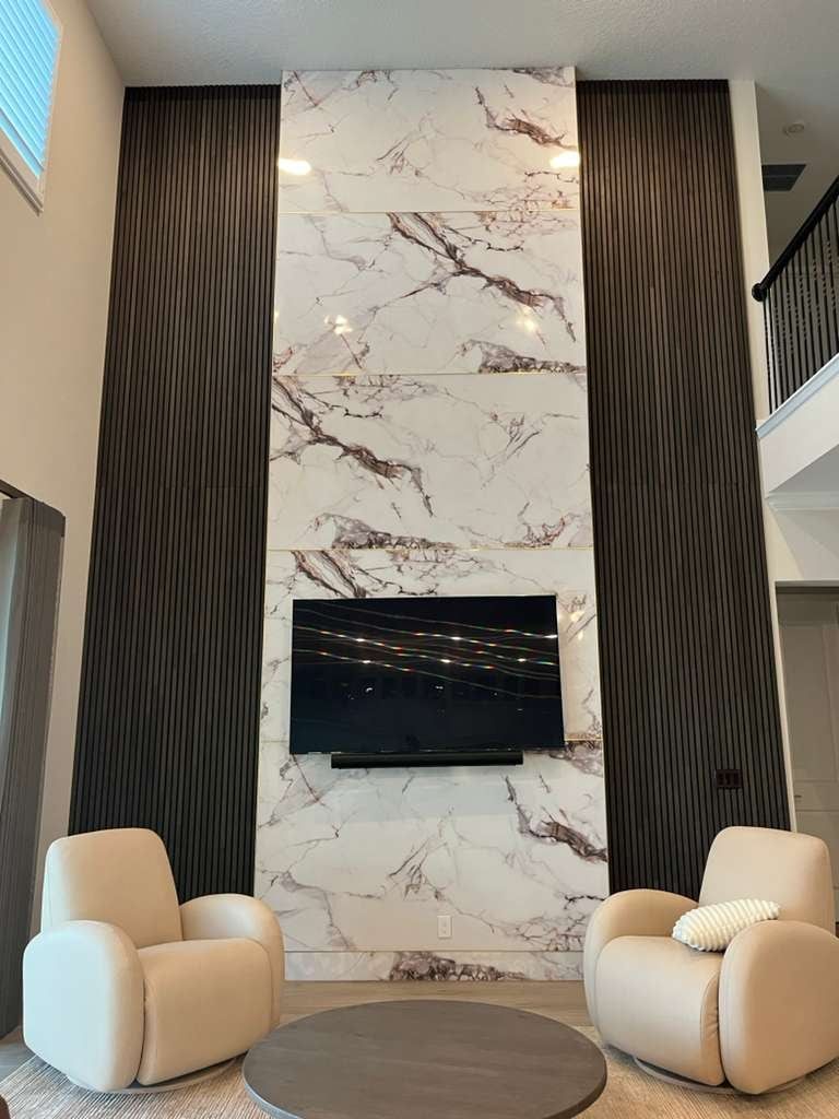 Marble-Look Slab Media Wall with Wood Slat Sides in Melbourne, FL