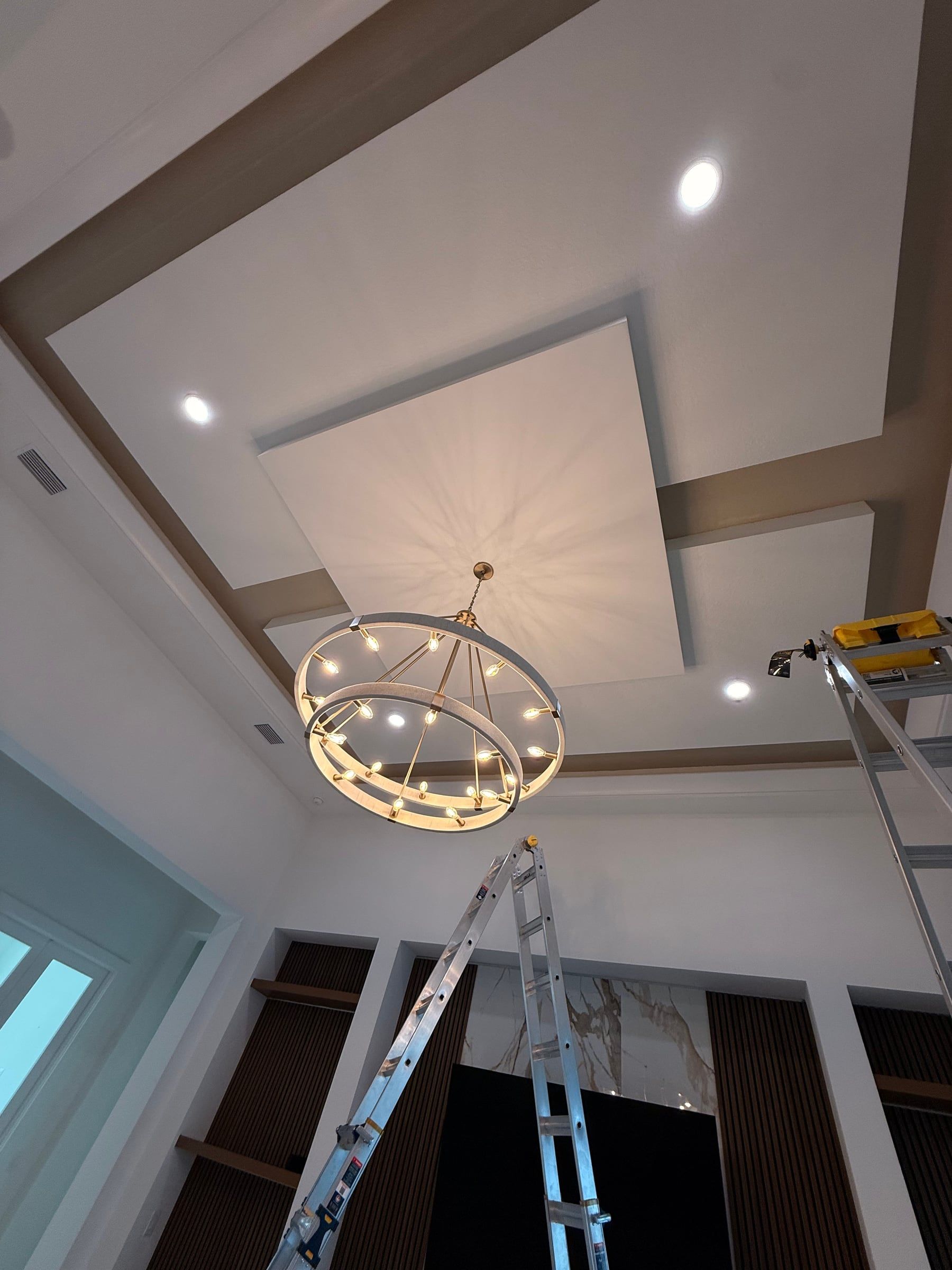 Media Wall with Built-In Shelving and a Tray Ceiling Detail in Sarasota, FL — photo 2 of 8