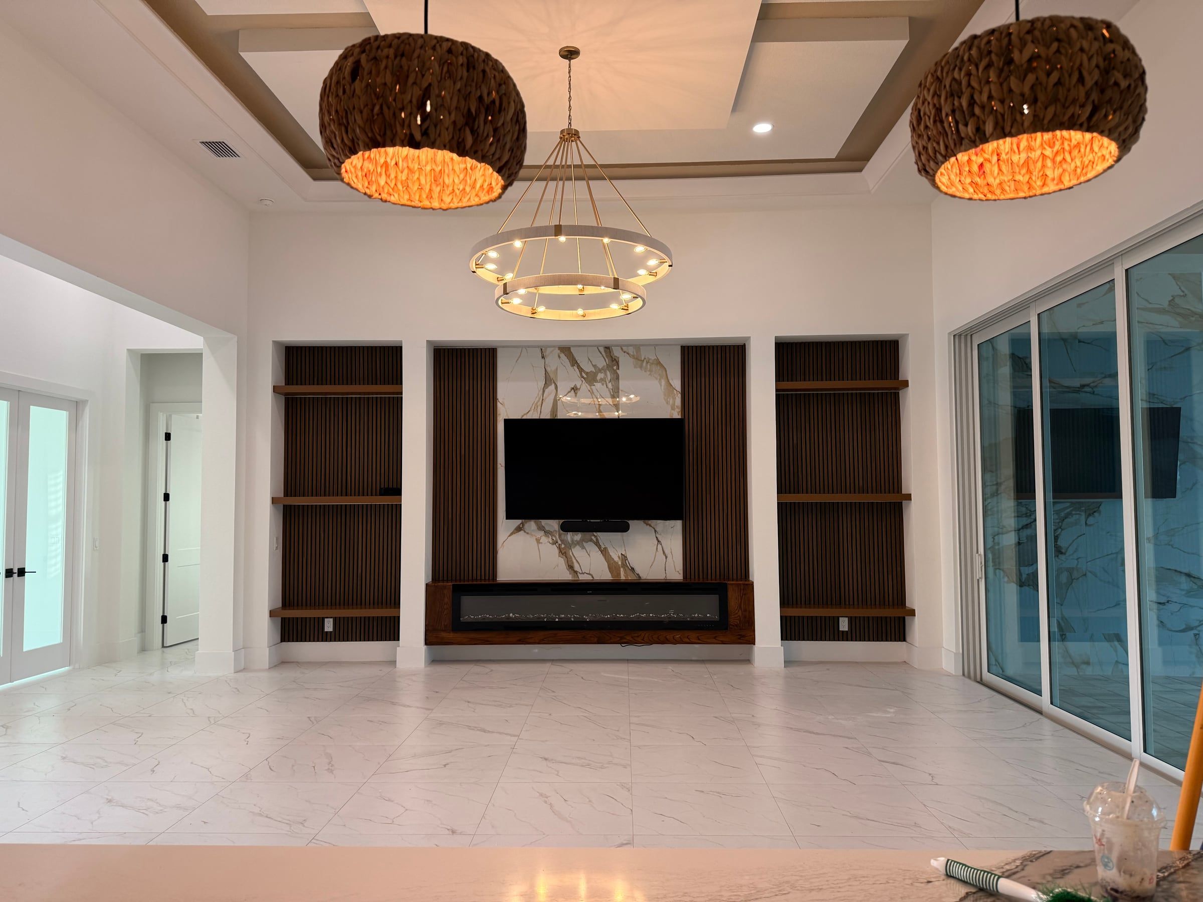 Media Wall with Built-In Shelving and a Tray Ceiling Detail in Sarasota, FL — photo 4 of 8