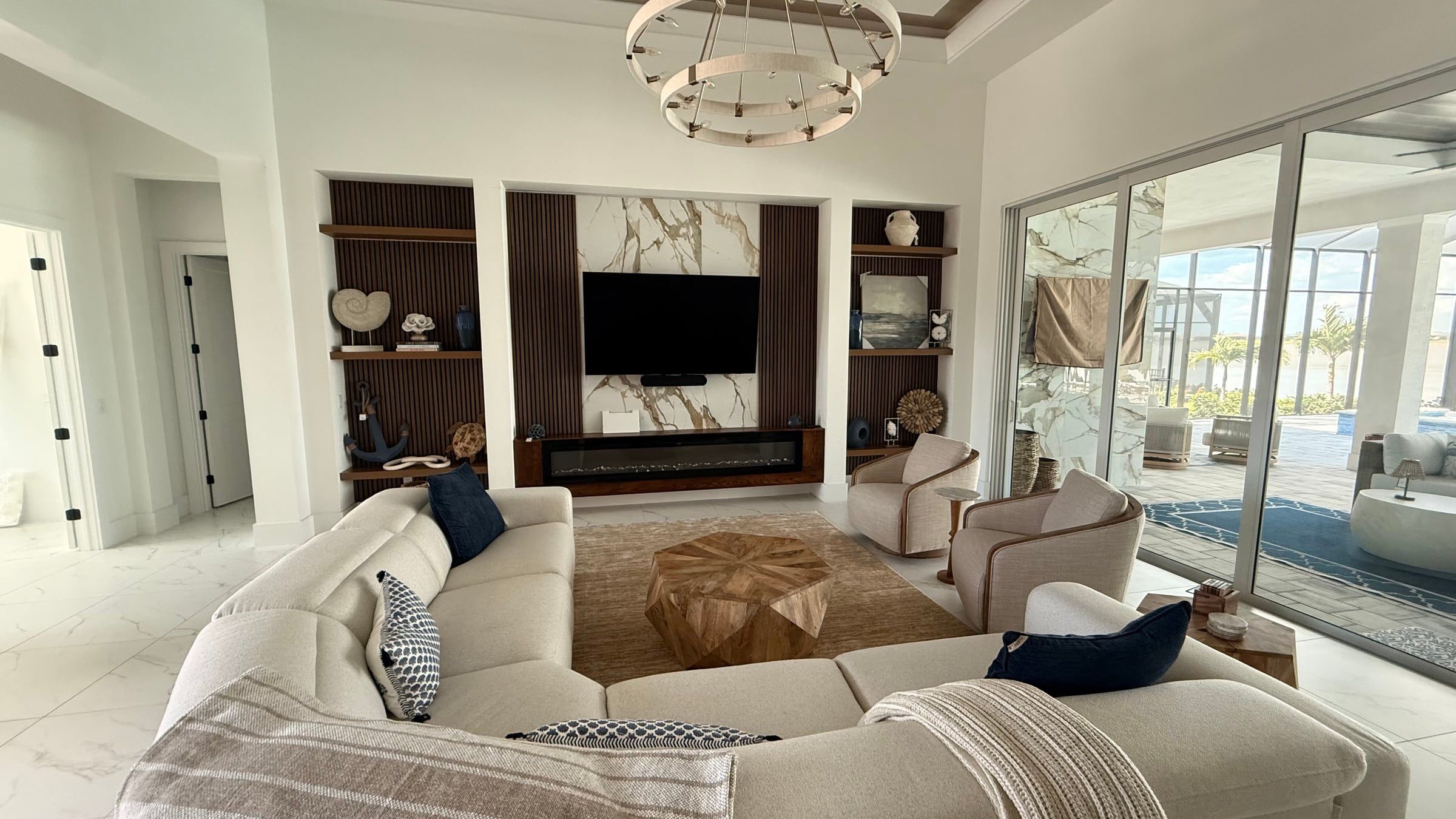 Media Wall with Built-In Shelving and a Tray Ceiling Detail in Sarasota, FL — photo 7 of 8