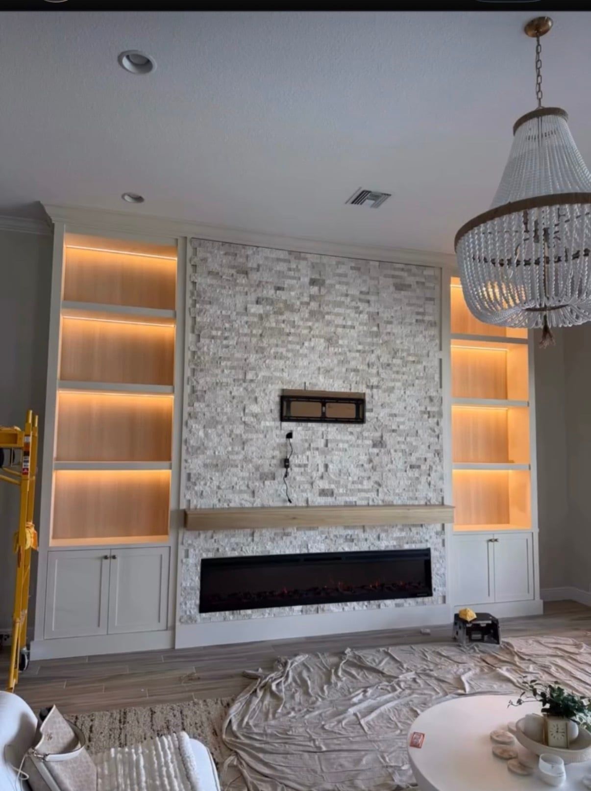 Media Wall with Lit Built-In Shelving and Electric Fireplace in Davenport, FL — photo 2 of 4