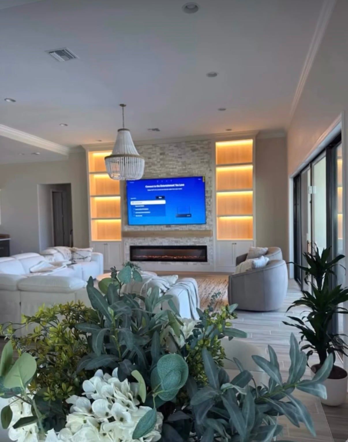 Media Wall with Lit Built-In Shelving and Electric Fireplace in Davenport, FL