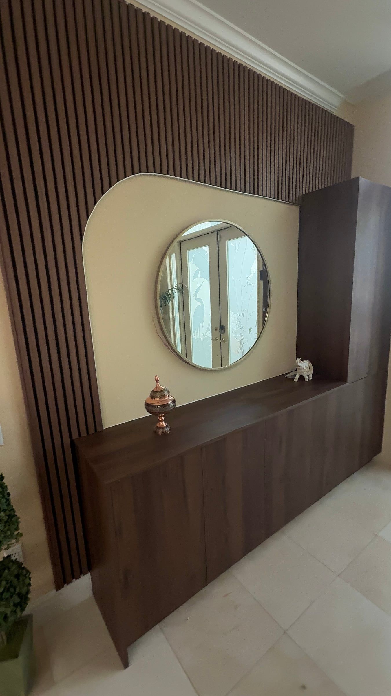Wood Slat Wall with a Mirror Niche and Floating Vanity in Sarasota, FL